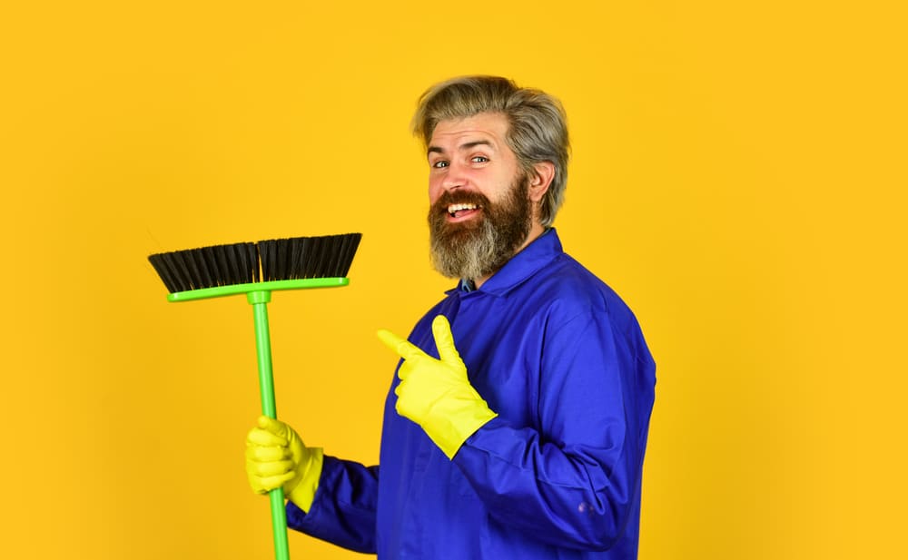 man getting ready to sweep